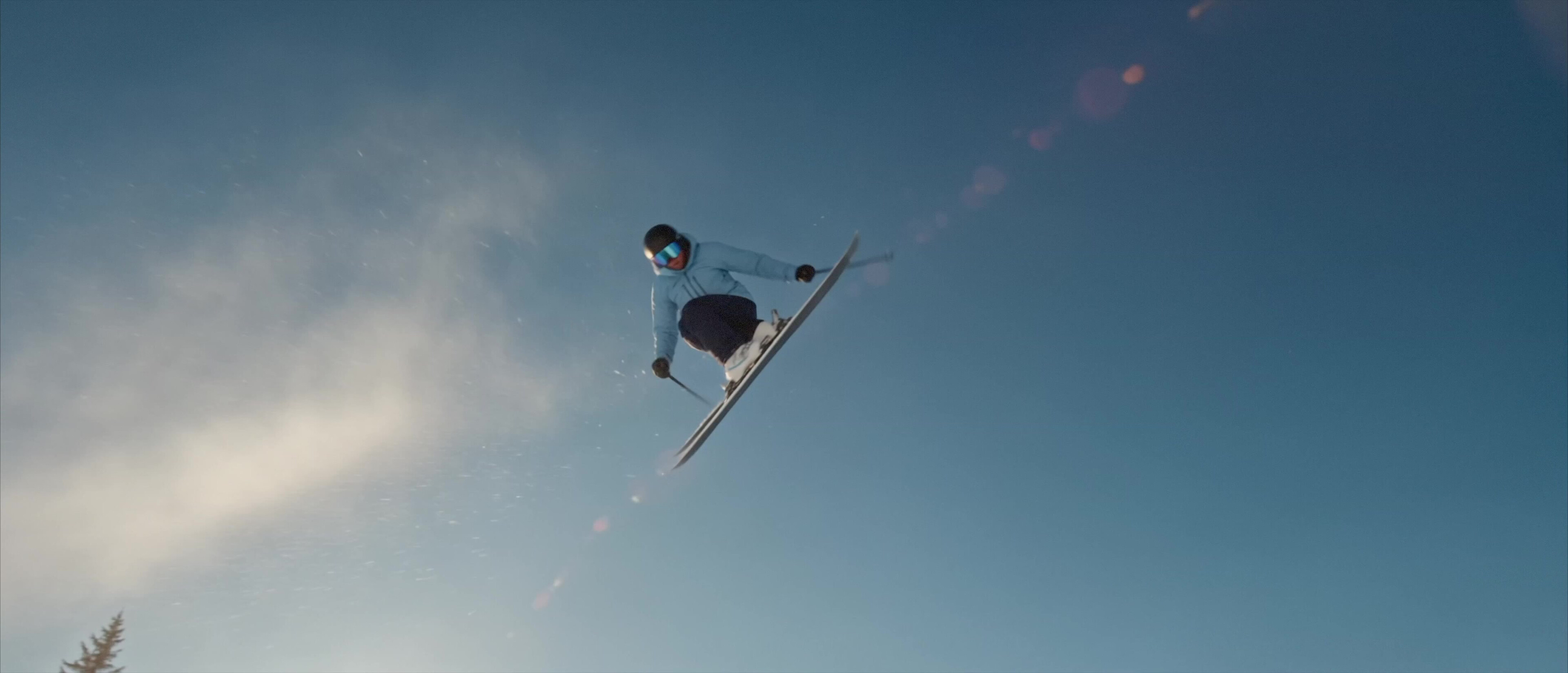 Moccamaster ICE - Skier airborne against a clean blue sky